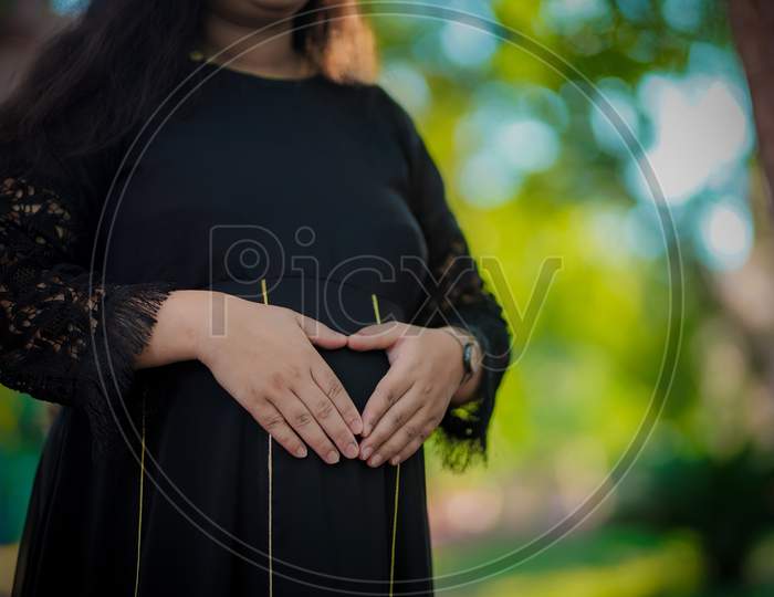 Pregnant Women Hands On Bump