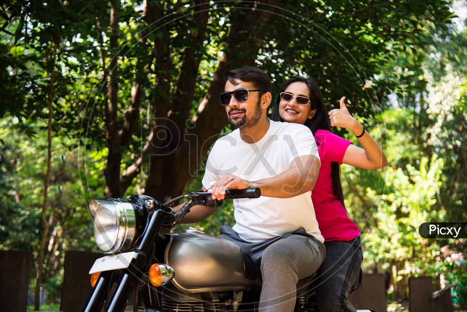 Asian Indian Happy Couple Riding On Motorbike
