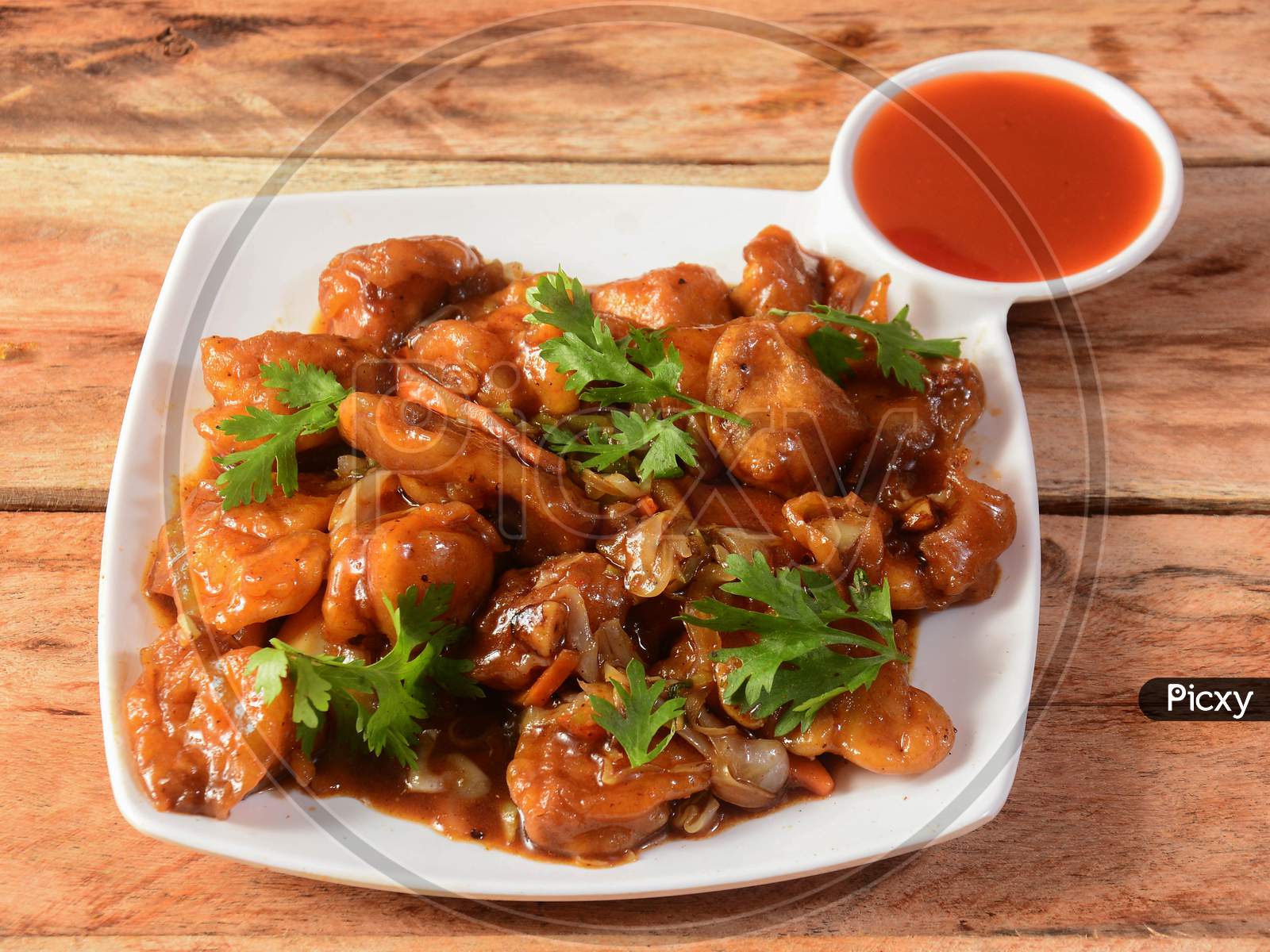 Egg Manchurian Served On Rustic Wooden Background
