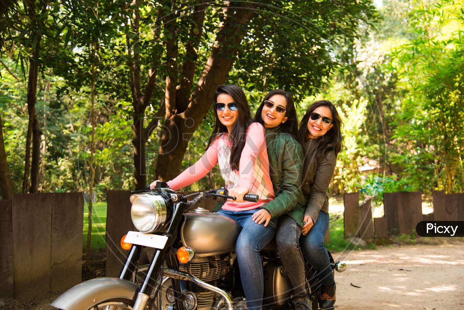 Happy Asian Indian Young Woman Or Female Friends Riding On Motorcycle Or Motorbike