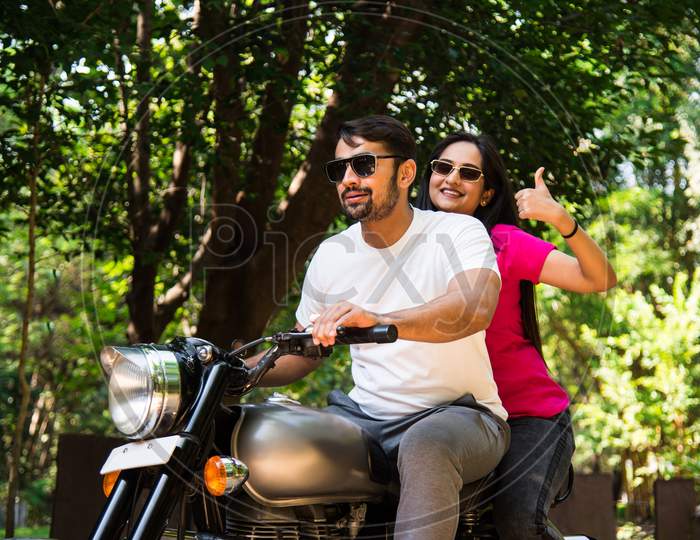 Asian Indian Happy Couple Riding On Motorbike