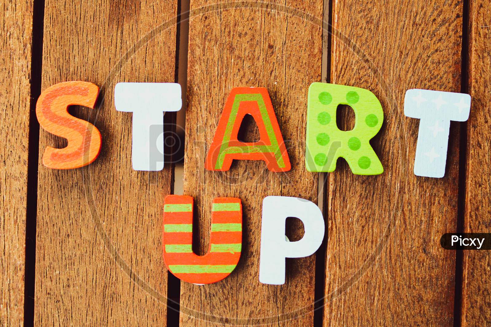 Start Up Letters On Wood Background