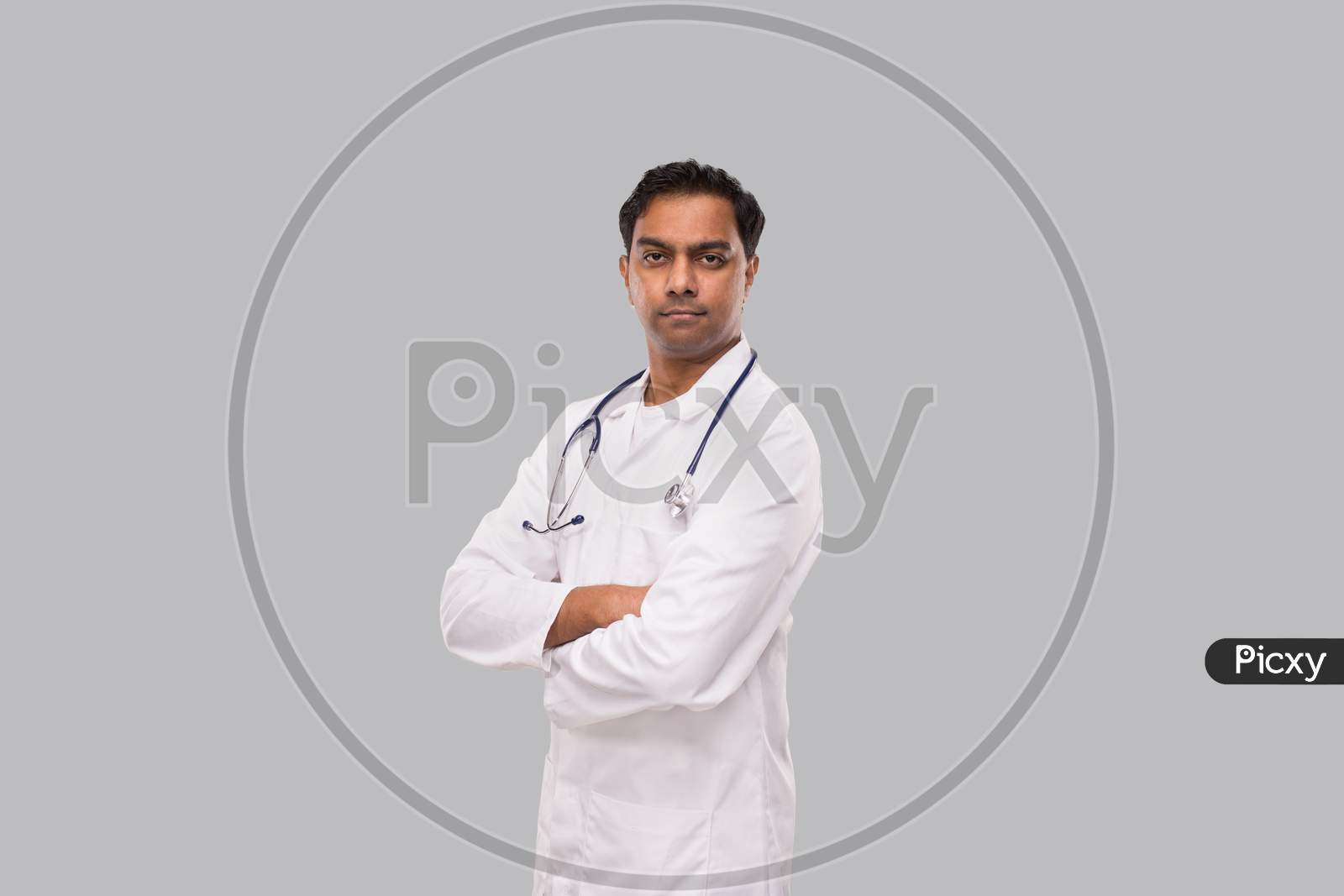 Indian Man Doctor Serious Face Hands Crossed Isolated. Healthy Life, Medicine Concept.