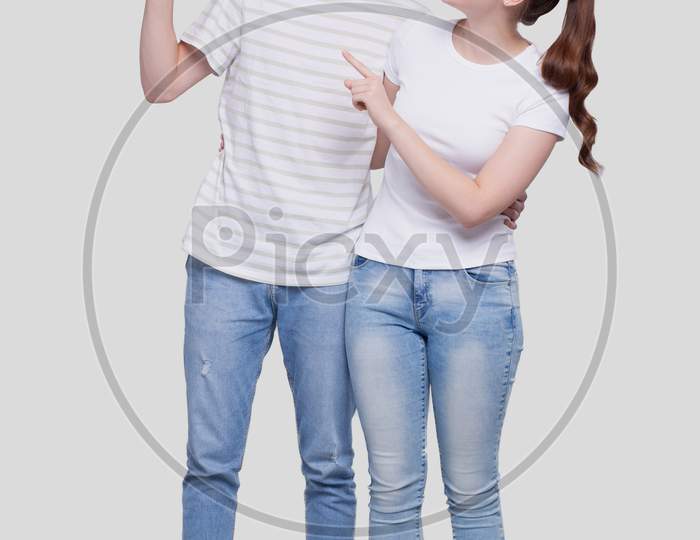 Couple Pointing To Up Standing Isolated. Man And Woman Pointing, Lovers, Friends, Couple Concept