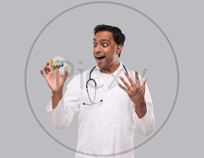 Doctor Excited Examing Petri Dish Isolated. Indian Man Doctor Medicine, Science Concept