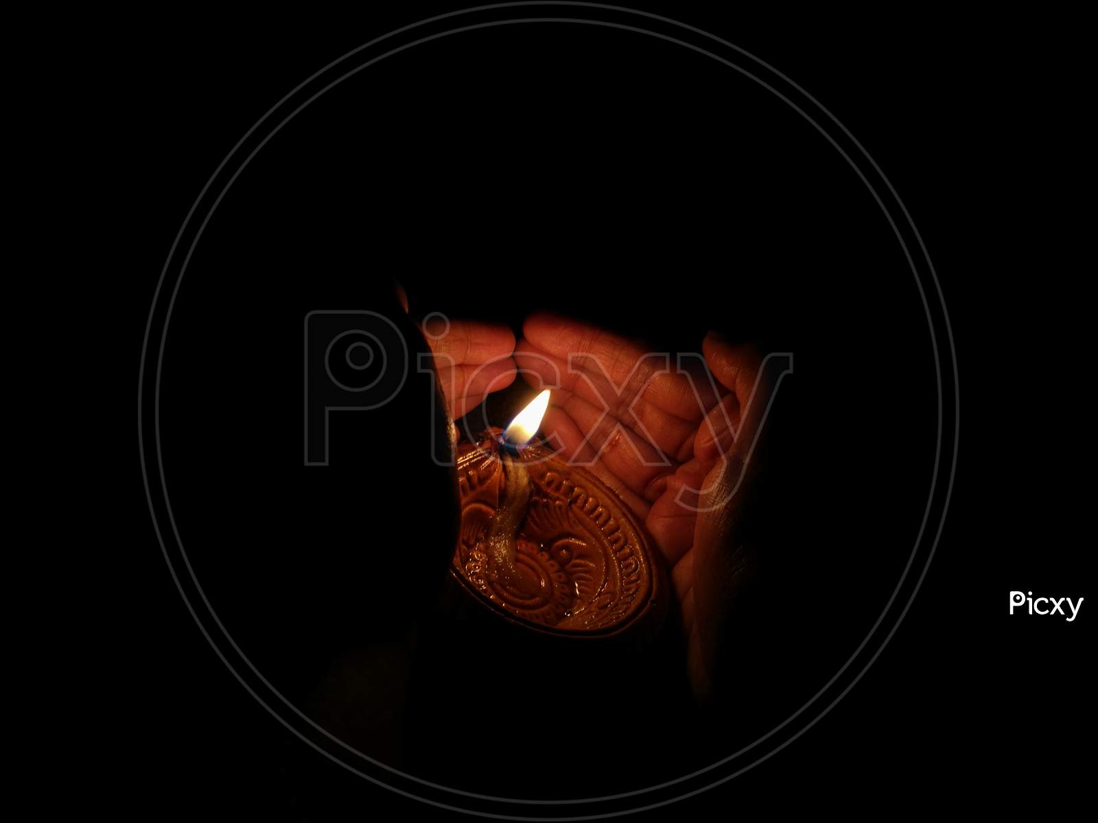 A Girl Covering Oil Lamp From Her Hands From Wind In Diwali Festival