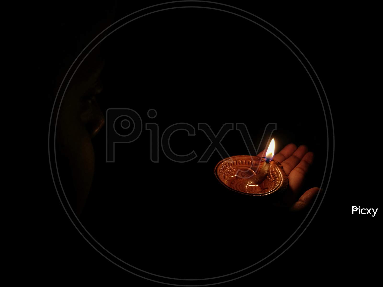 A Girl Holding Oil Lamp In Her Hands On The Occasion Of Hindu Festival Diwali