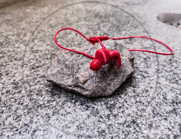 Picture Of Red Color Wireless Earphone Or Ear Buds