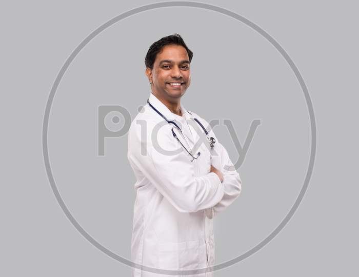Indian Man Doctor Smiling Hands Crossed Isolated. Healthy Life, Medicine Concept.
