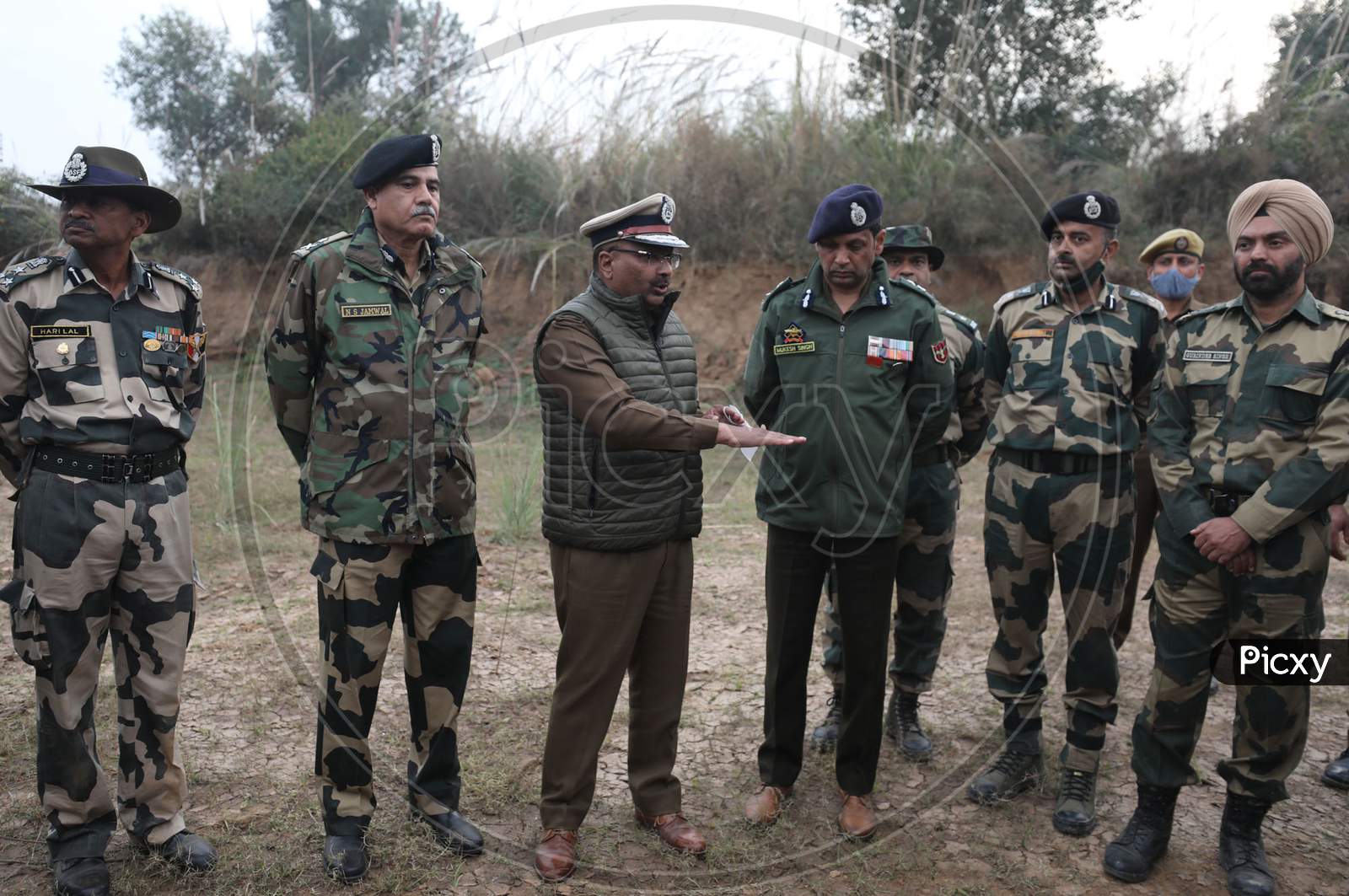 Police officers and Bsf inquire an underground tunnel near the international border in Samba sector, suspected to have been used by terrorists killed in a recent encounter in Nagrota, in Jammu district, Sunday, Nov. 22, 2020.