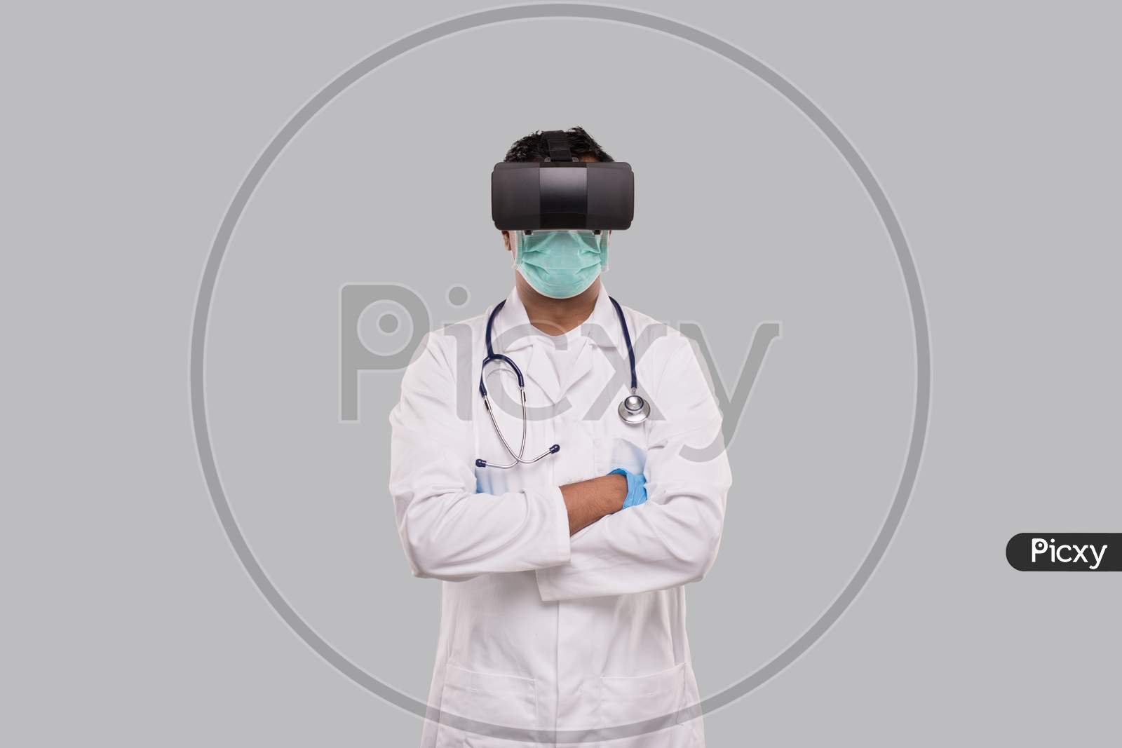 Doctor Wearing Vr Glasses, Medical Mask And Gloves Hands Grossed Isolated. Indian Man Doctor Online Medicine