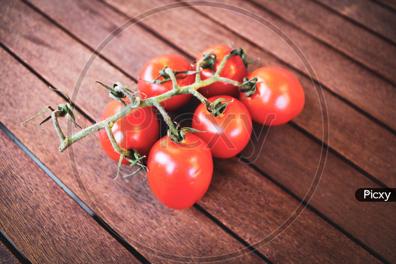 Red Tomatoes On Wood Background