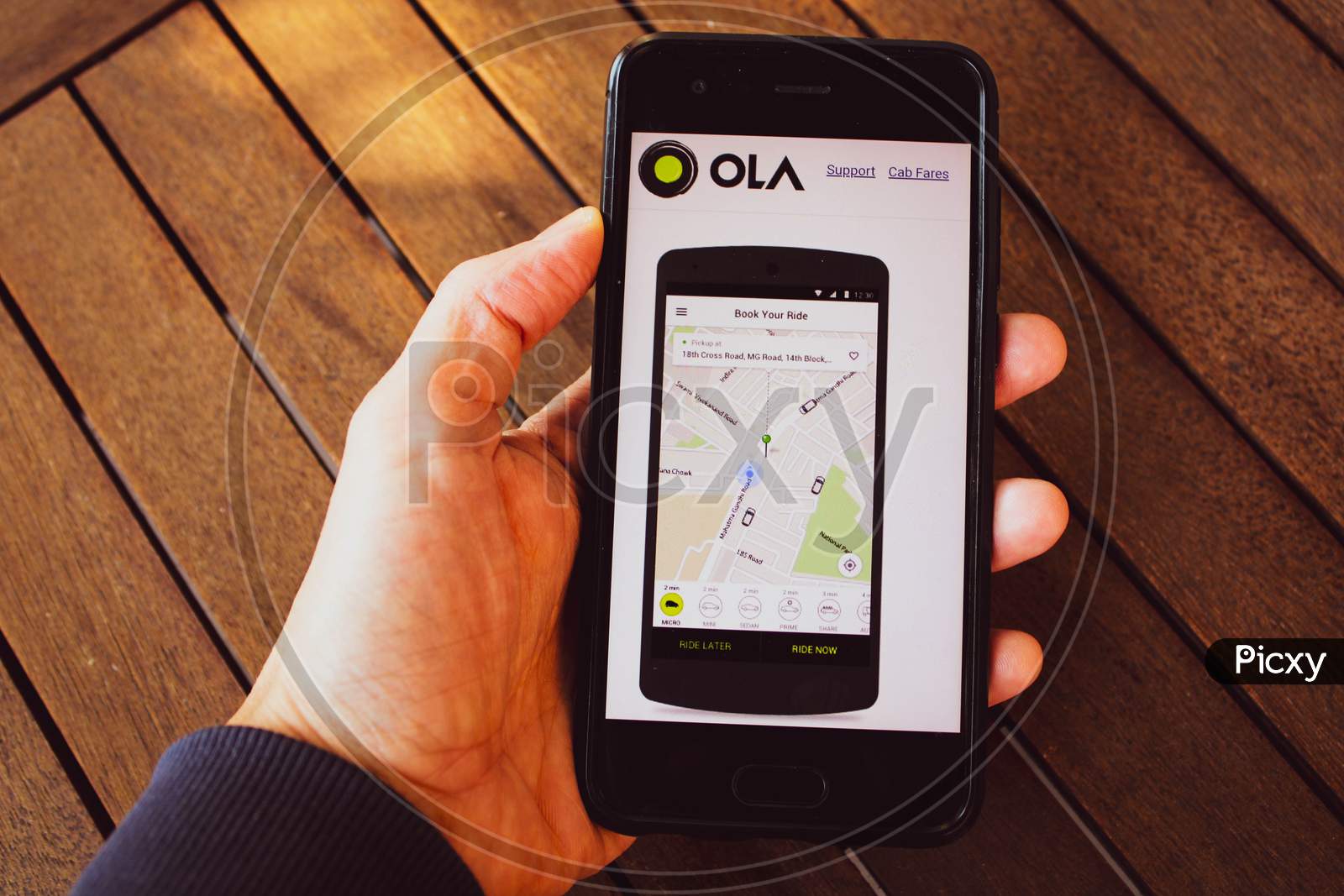 Ola App Booking Cabs From Smarthphon