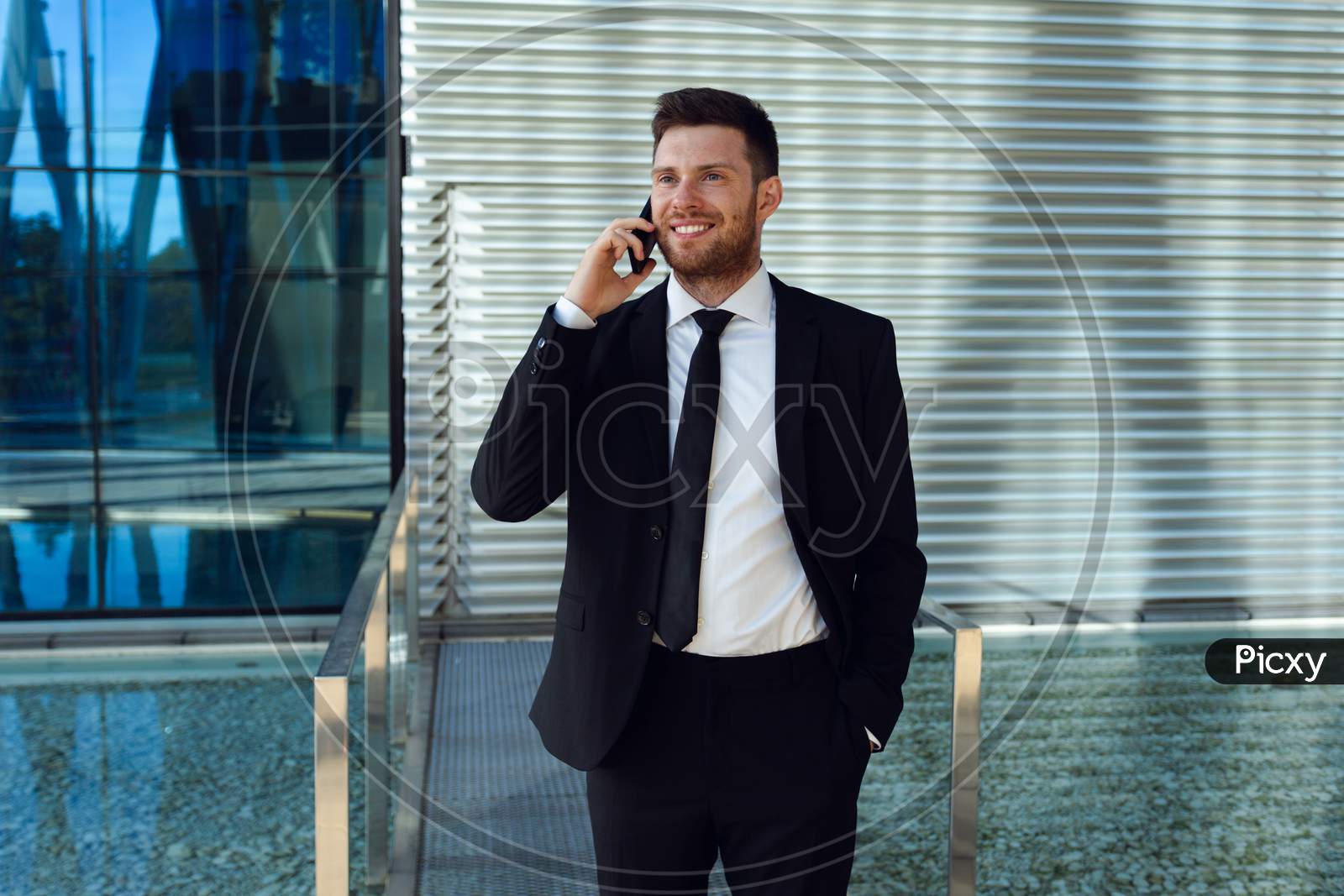 Businessman Talking On Phone Isolated. Business Man Standing Full Length With Phone In Hand