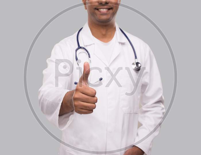 Doctor Showing Thumb Up Smilling Close Up. Isolated Indian Man Doctor