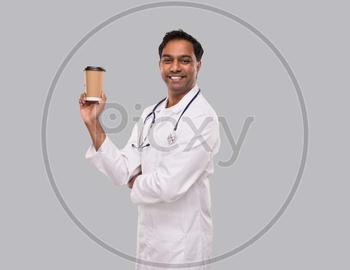 Indian Man Doctor Holding Coffee Take Away Cup Smiling Isolated. Indian Doctor Holding Coffee To Go Cup.