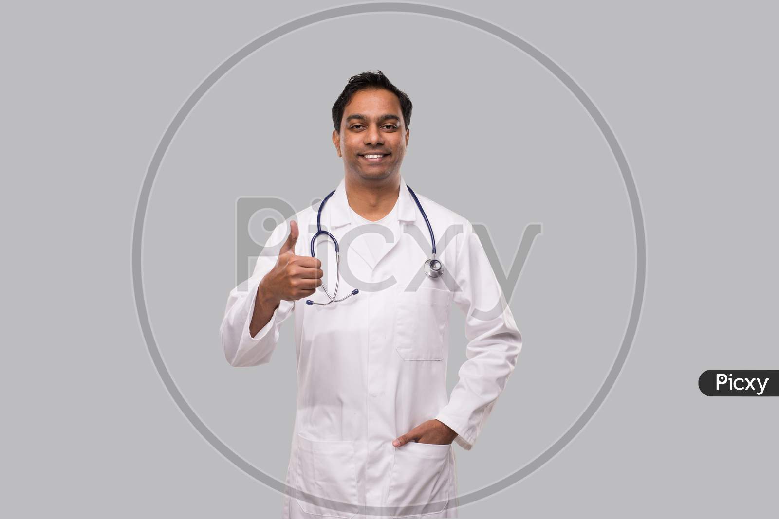 Indian Man Doctor Showing Thumb Up Smilling. Isolated