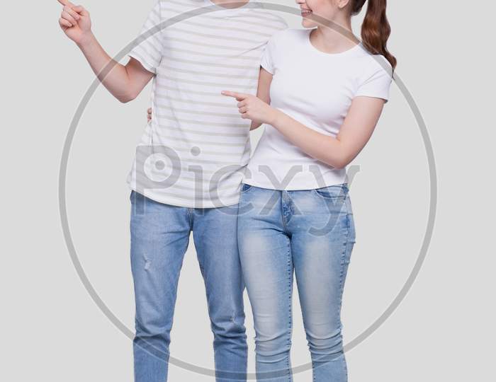 Couple Pointing To Side Standing Isolated. Man And Woman Pointing, Lovers, Friends, Couple Concept