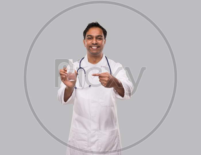 Doctor Pointing At Hands Sanitizer. Hands Wash Antiseptic. Corona Virus Concept. Isolated
