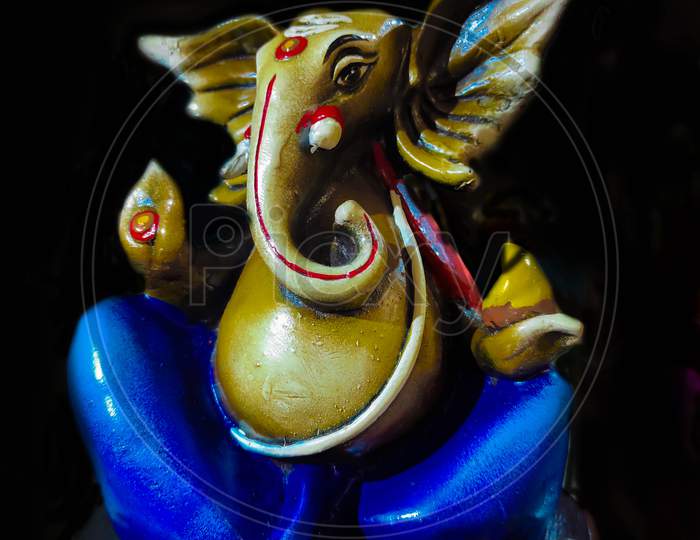 Colorful Artistic Figurine Of Lord Ganesha In Black Background.
