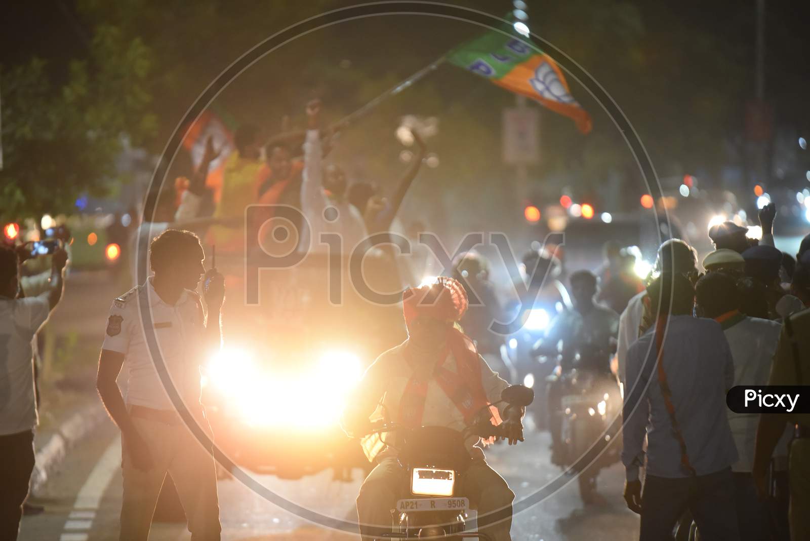 A Traffic Police stands guard at a BJP Rally in Miyapur Hyderabad during GHMC Elections 2020