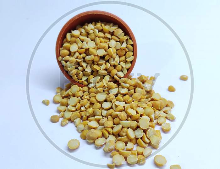 Split Chickpea Also Know As Chana Dal, Bright Yellow Dried Chickpea Lentils In Bowl On White Background
