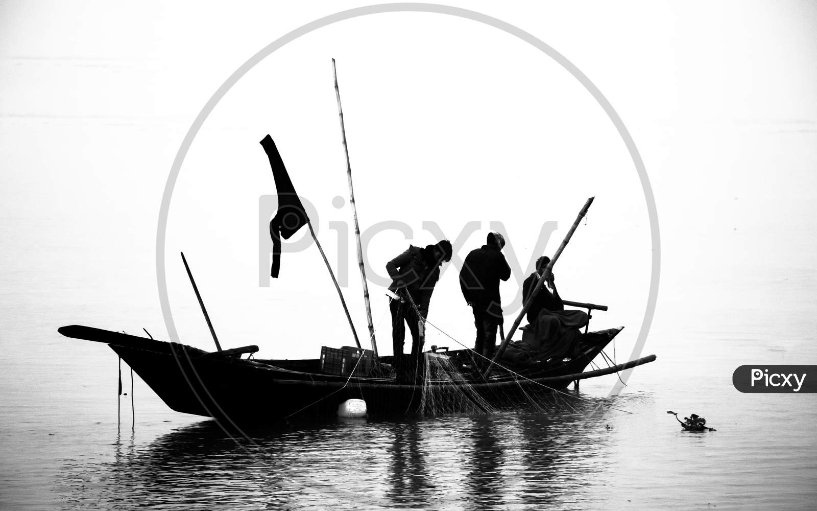 Fisherman Fishing In The Winter Morning