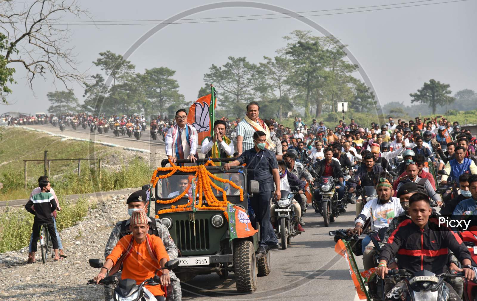 Senior BJP leader and NEDA convener Himanta Biswa Sarma, Assam BJP President Ranjeet Kumar Dass, MP Dilip Saikia National General Secretary waves at his supporters during a rally, at Kumarikata in Assam’s Baksa on Sunday, November 22, 2020.