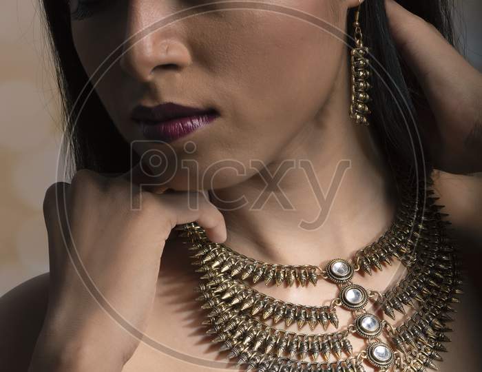 Young Indian woman wearing contemporary fashion jewelry