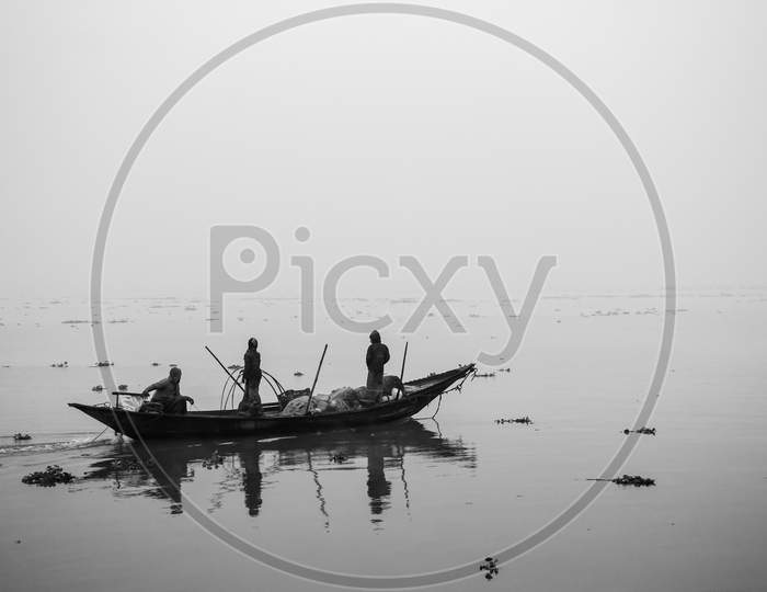 Fisherman Fishing In The Winter Morning,