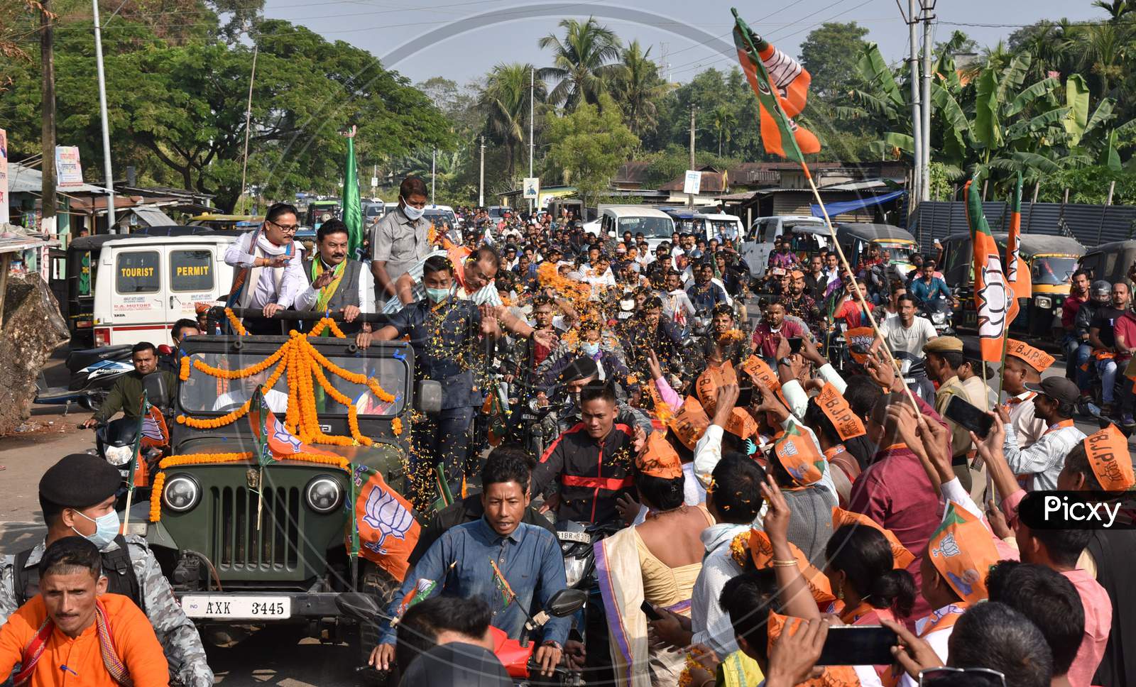Senior BJP leader and NEDA convener Himanta Biswa Sarma, Assam BJP President Ranjeet Kumar Dass, MP Dilip Saikia National General Secretary waves at his supporters during a rally, at Kumarikata in Assam’s Baksa on Sunday, November 22, 2020.