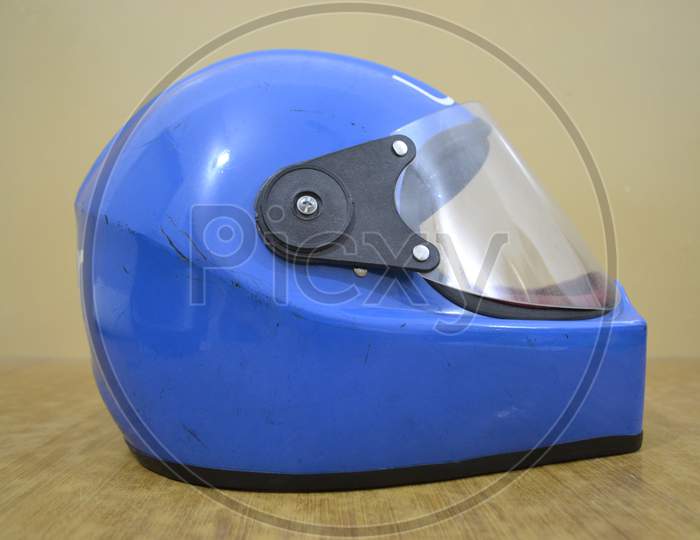 Blue motorcycle helmet, head safety.