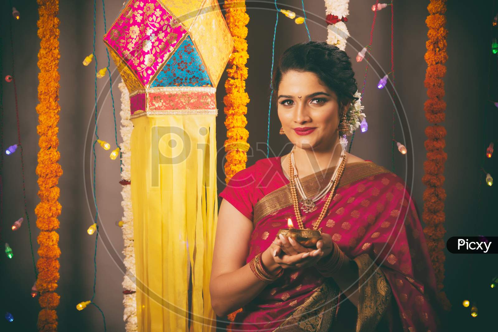 Young Indian woman celebrating Diwali festival