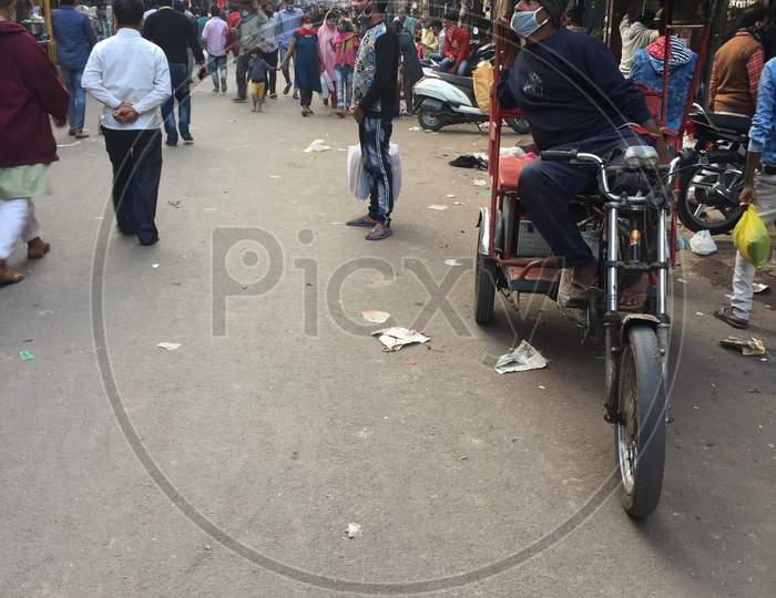 Poor Old Rickshaw Driver With His Bicycle Rickshaw In old delhi market, delhi India, 22 Nov 2020