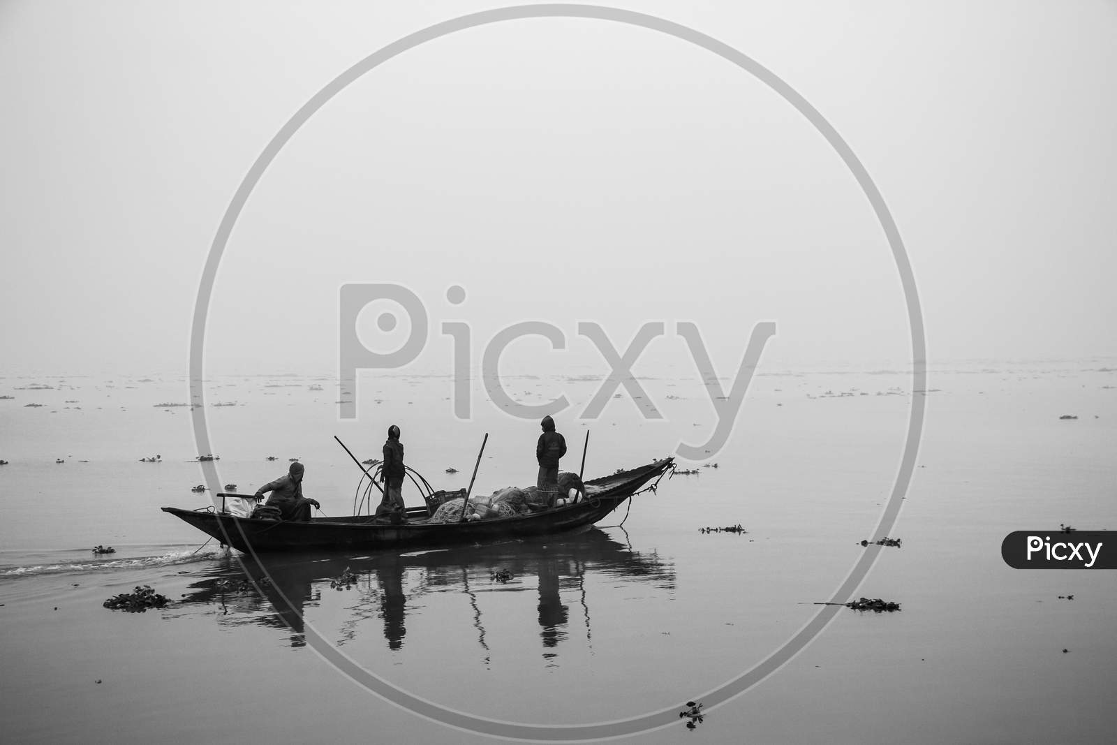 Fisherman Fishing In The Winter Morning,