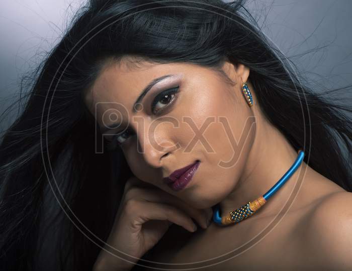 Young Indian woman wearing contemporary fashion jewelry