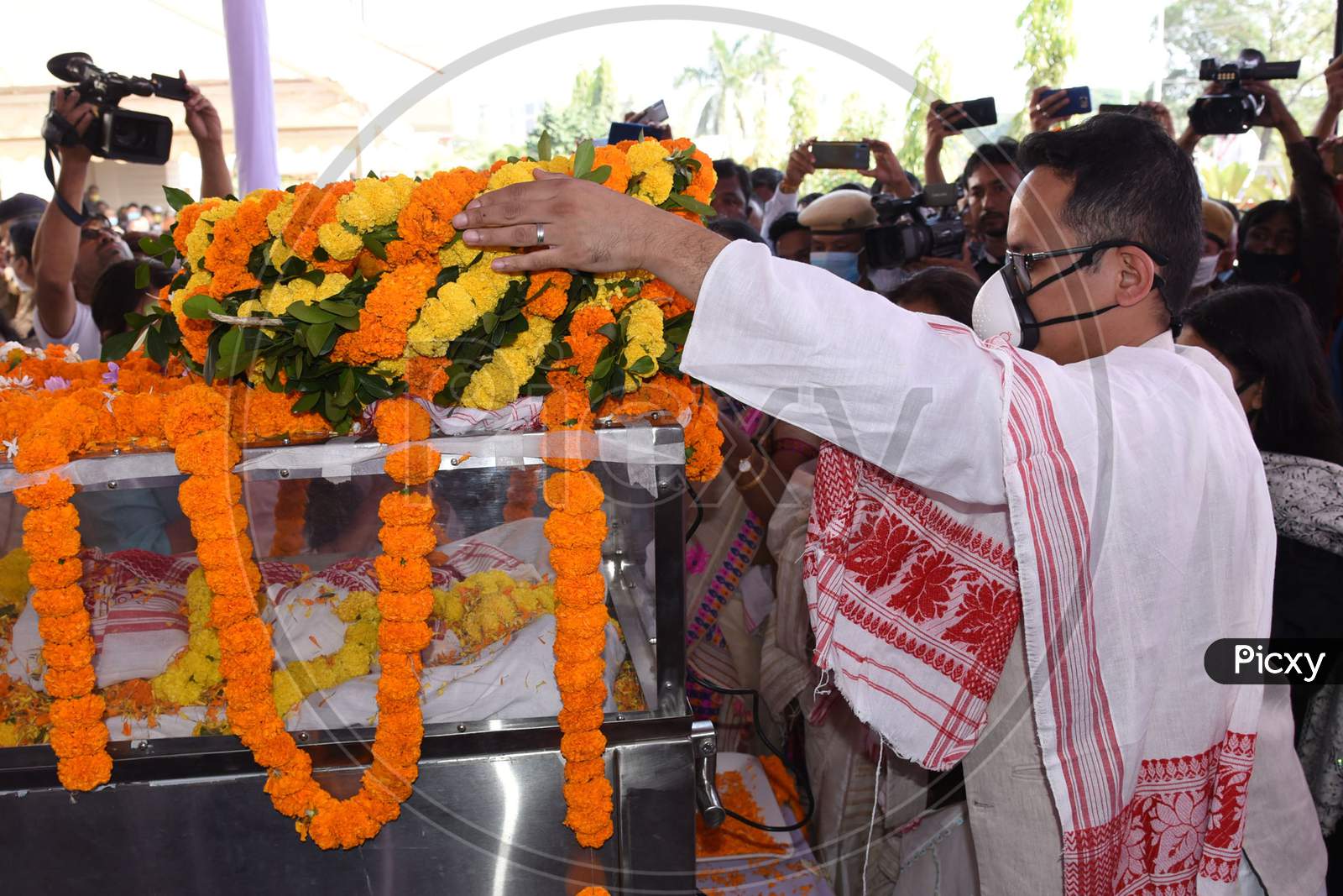Congress MP and Lok Sabha member Gaurav Gogoi  pay his  last respects to his father and  former Assam Chief Minister Tarun Gogoi in Guwahati, Tuesday, Nov 24, 2020.