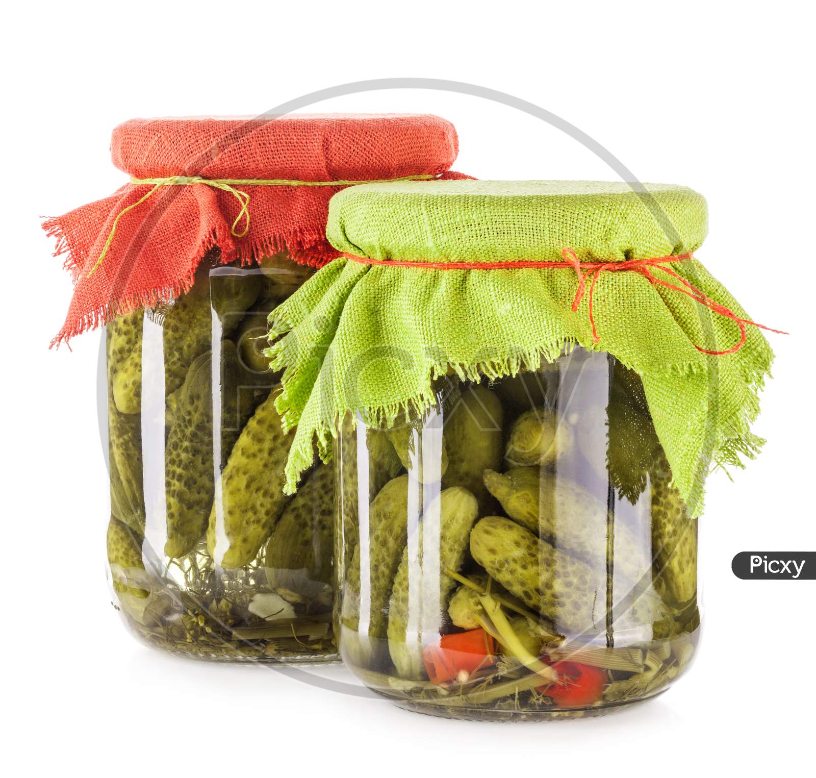 Pickles Cucumbers And Gherkins In Glass Jar Isolated On White