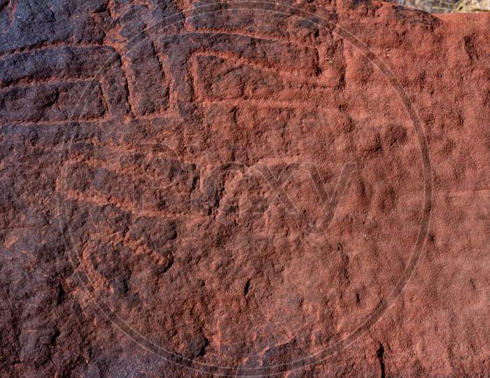 Petroglyphs In Argentina. Stone Carved Thousands Of Years Ago By Early Humans.
