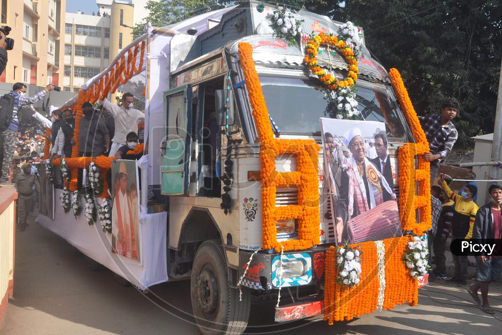 A vehicle carrying the mortal remains of former Assam chief minister and former APCC president late Tarun Gogoi moves towards his own residence during his funeral procession in Guwahati on Tuesday, Nov. 24, 2020.