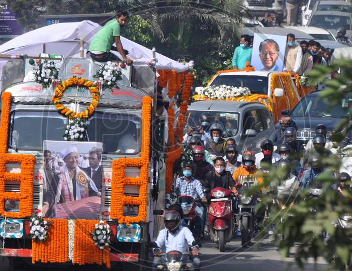 A vehicle carrying the mortal remains of former Assam chief minister and former APCC president late Tarun Gogoi moves towards his own residence during his funeral procession in Guwahati on Tuesday, Nov. 24, 2020.