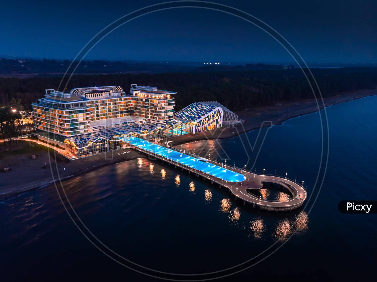 View To Seaside Hotel And Beach In Shekvetili At Dusk. Paragraph Hotel Building Architecture From Aerial Perspective.  Georgia