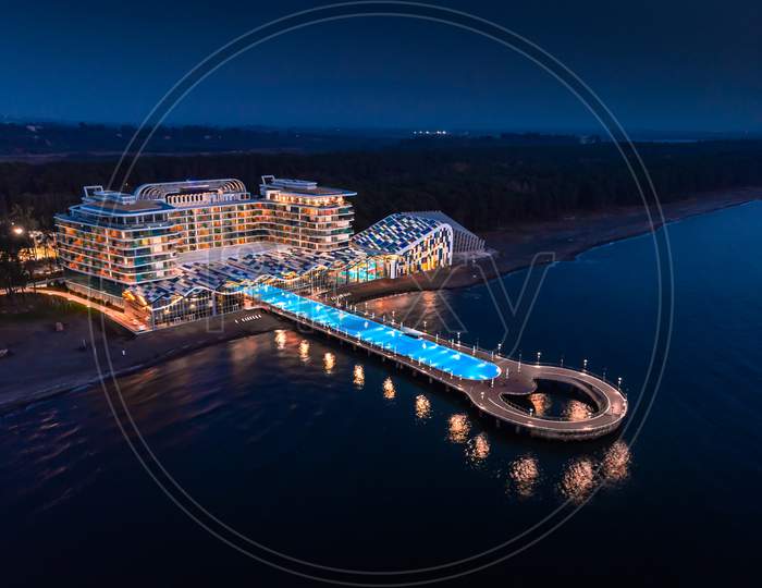 View To Seaside Hotel And Beach In Shekvetili At Dusk. Paragraph Hotel Building Architecture From Aerial Perspective.  Georgia