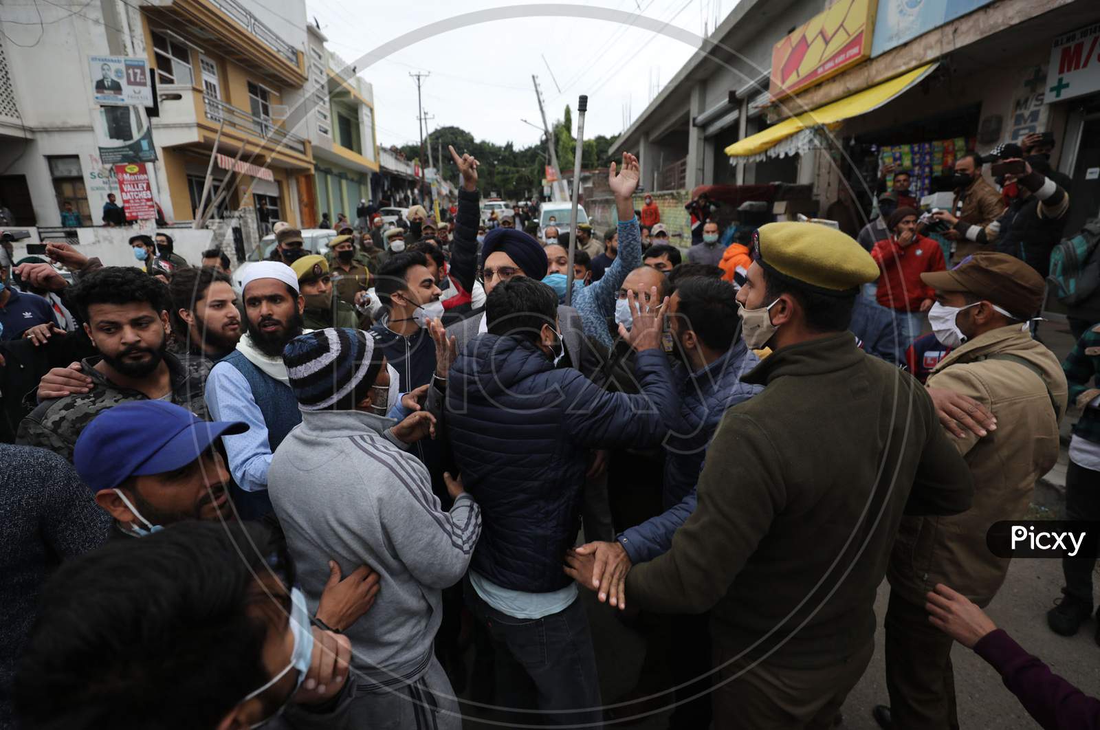Policemen stops National Conference supporters from marching towards main road after Bjym activists made an unsuccessful attempt to stage a protest outside former chief minister Farooq Abdullah's residence in Jammu on Wednesday. The bjym activists were protesting against alleged encroachment of land