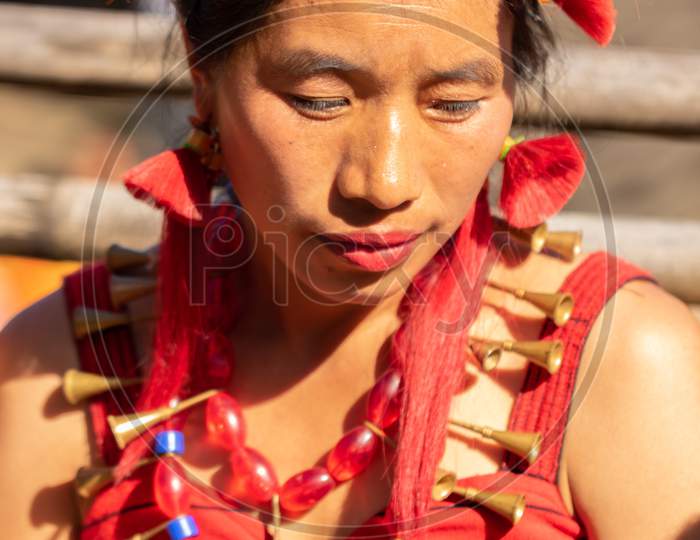 Portrait of a tribal Naga women dressed in traditional tribal attire