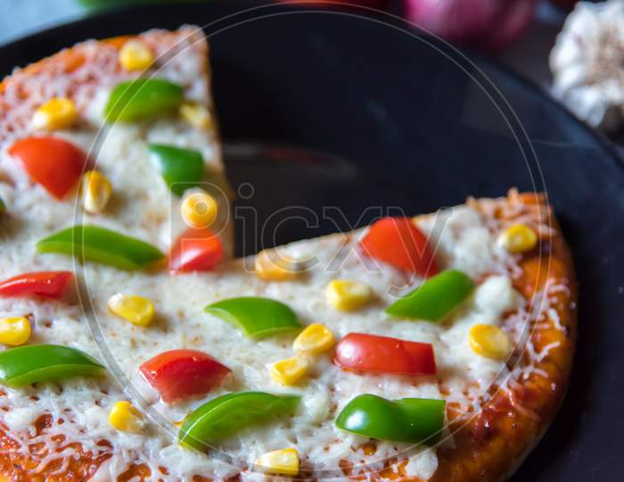 Close up of pizza with capsicum and tomatoes