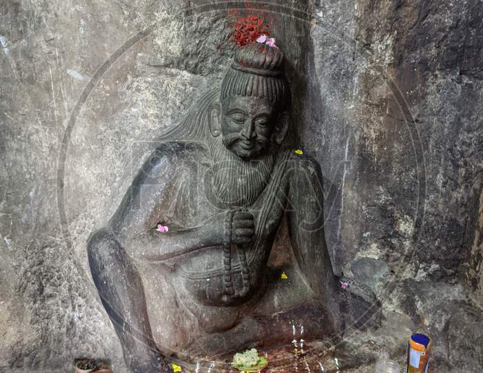 the budist monk sculpture in undavalli caves