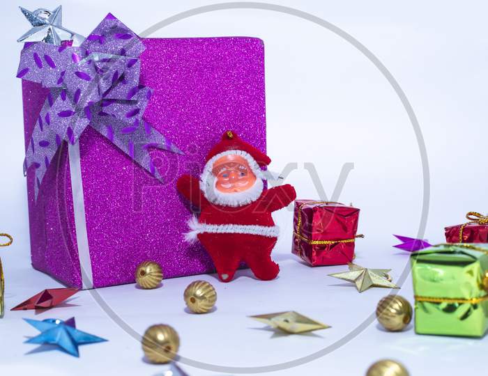 Christmas Decoration. Santa Claus With The Large Gift Box Is Isolated On A White Background