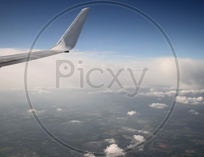 air plane wing with blue sky stock photo