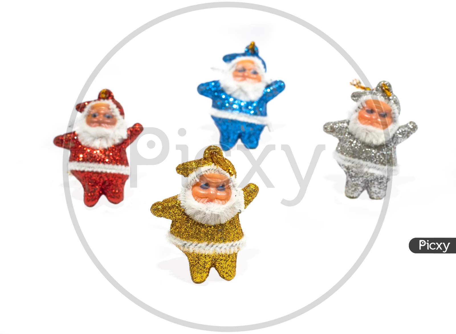 Multi-Colored Santa Claus On A White Background. Copy Space.